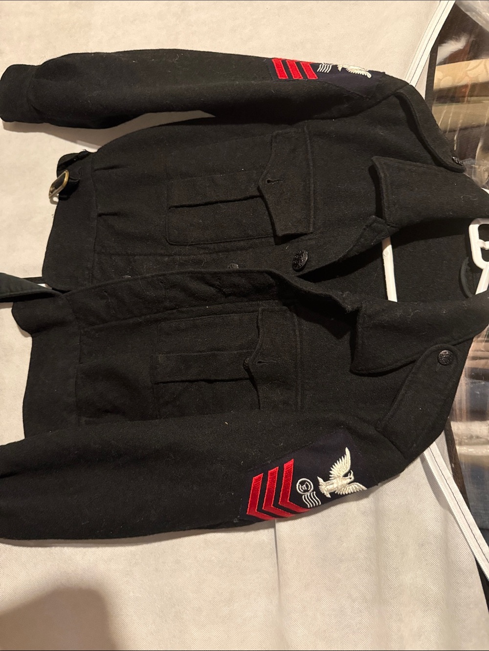 This is a vintage US Navy peacoat featuring a Petty Officer second class patch w